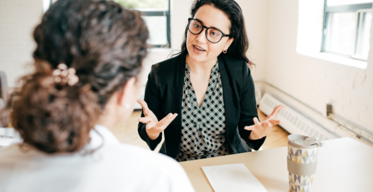 A healthcare professional offering lifestyle advice to a young person.