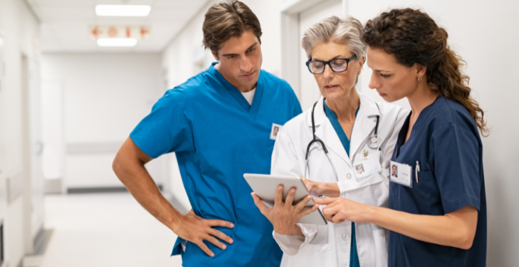 Doctor and Nurse Discussing Patient Case at Hospital