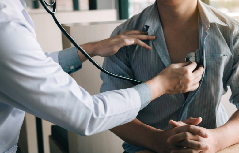 A doctor doing a health check up on a patient using a stethoscope 